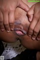 A black woman is getting her pussy licked by a man.